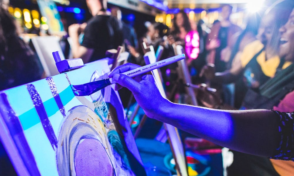 neon lit painting at party n paint