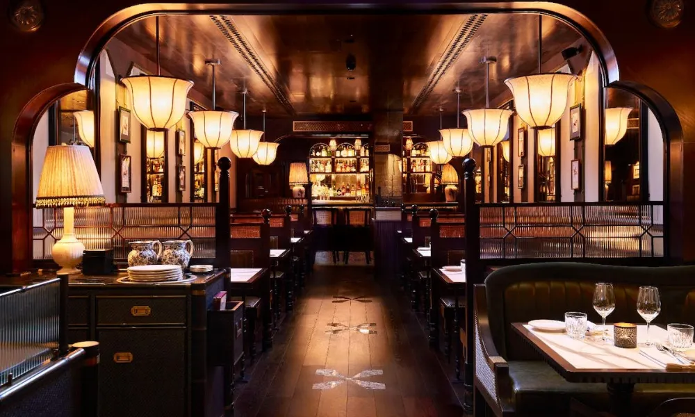 mood lighting and wooden booths at gymkhana