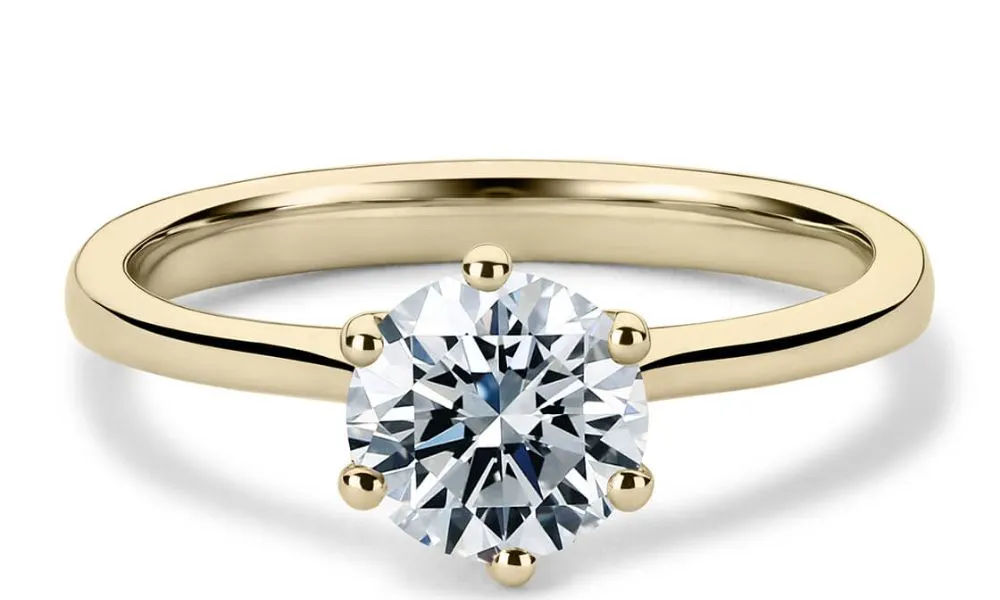 Gold band solitaire ring