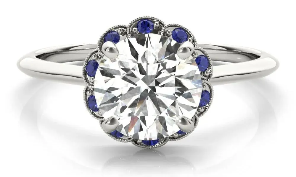 Diamond ring with sapphire details