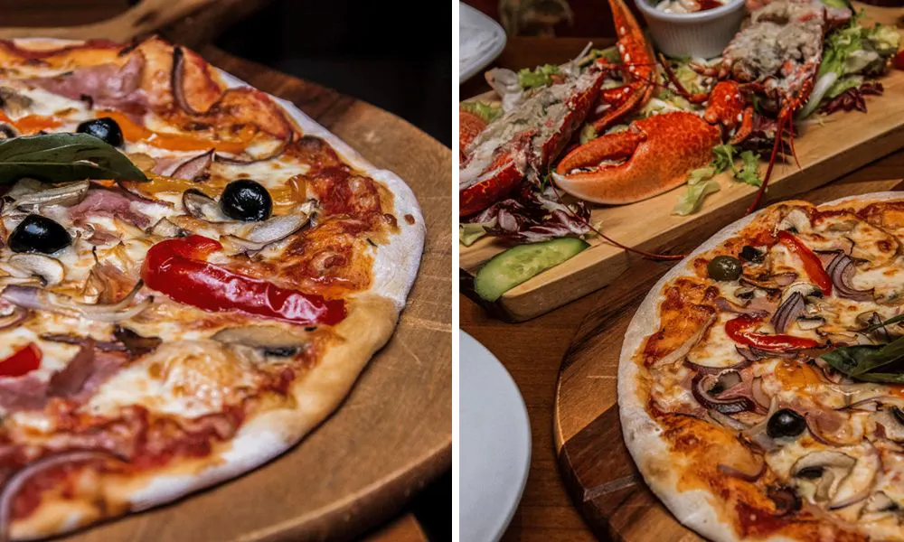 A selection of pizzas and a seafood platter