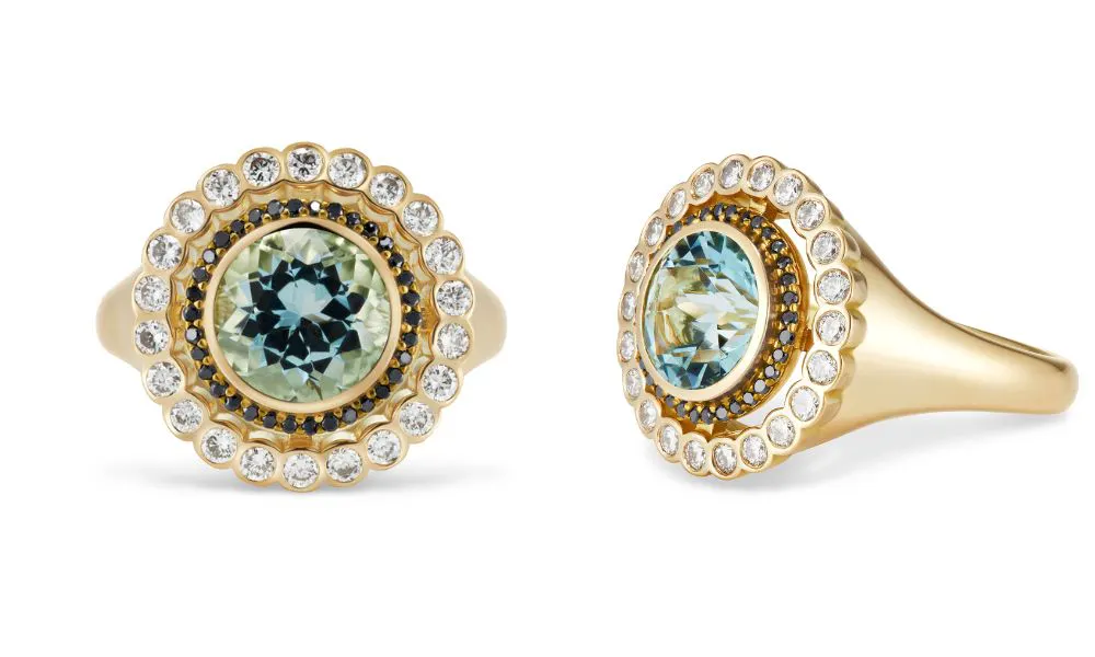 aquamarine gemstone which sits in the centre of an 18-carat gold satellite design