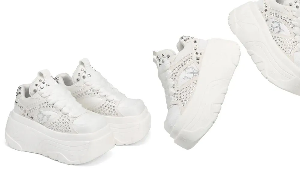 platformed white trainers with silver studs