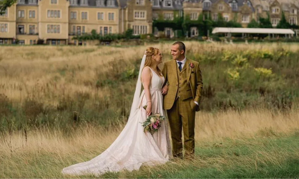 A couple getting married in front of South Lodge Hotel