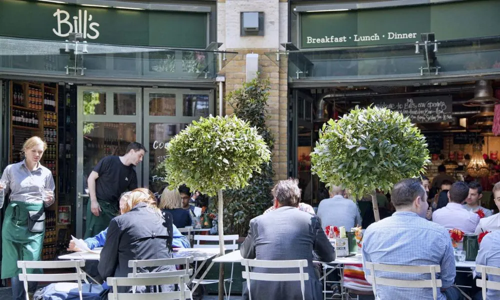 people eating brunch outside a cafe