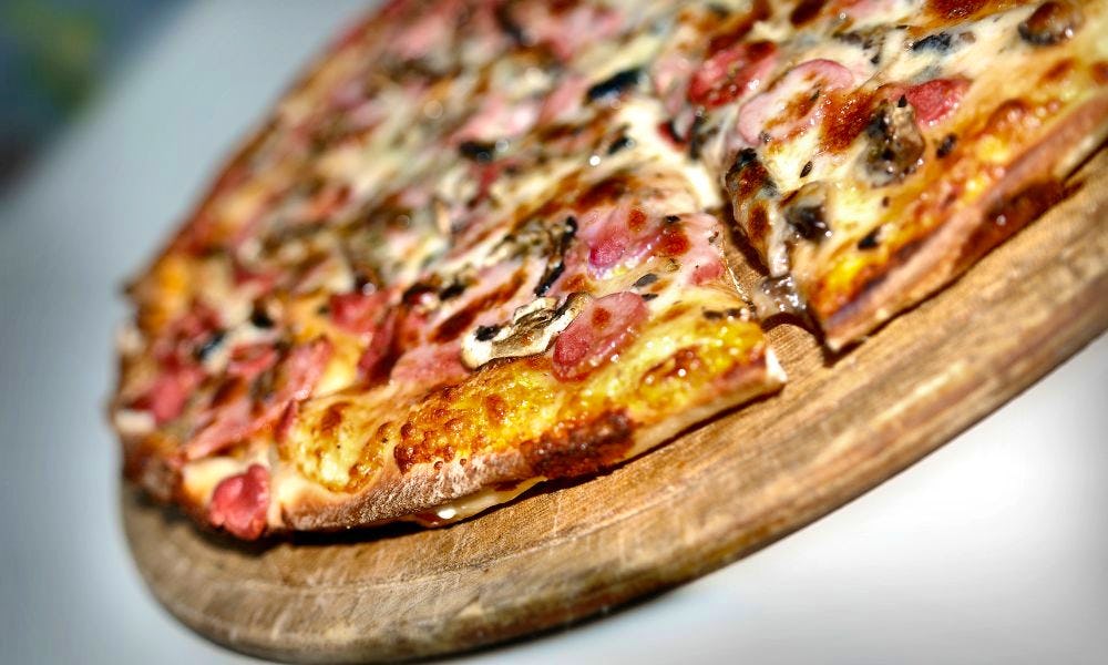 a ham and mushroom pizza