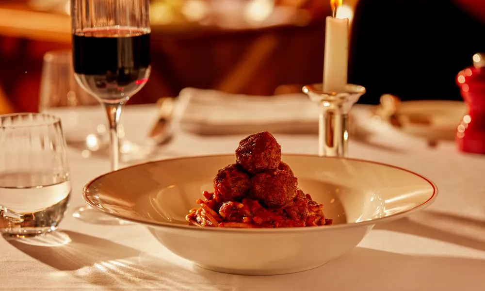  a bowl of meatballs and spaghetti