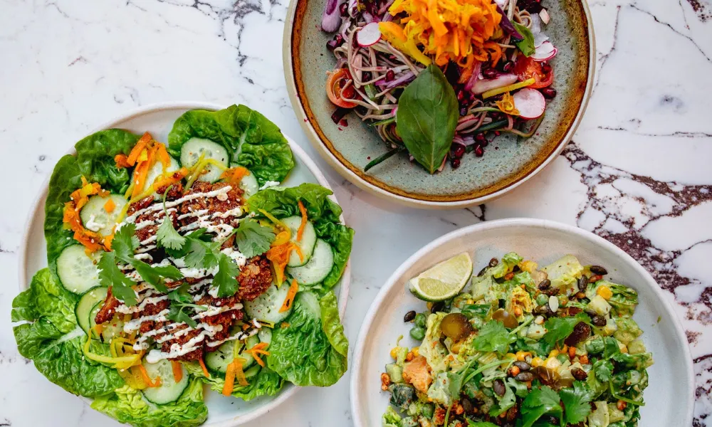 Colourful veggie dishes on table