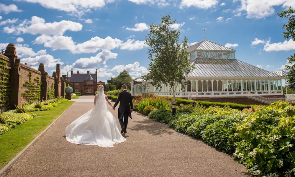 couple walking outside the conservatory