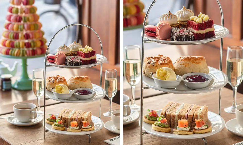 afternoon tea in a shop window with macaron tower