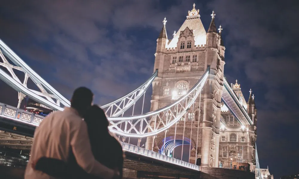 Couple standing near tower bridge