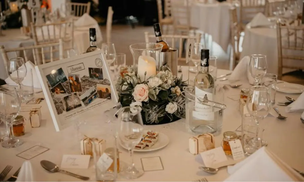 wedding table with name place cards and flowers