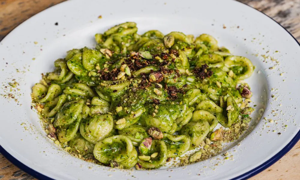 a bowl of pistachio pasta