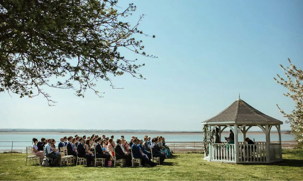 An outdoor wedding ceremony at Osea Island