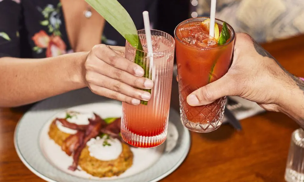 two cocktails and brunch dishes