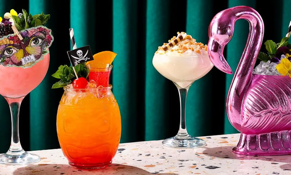 a selection of cocktails in unique glasses