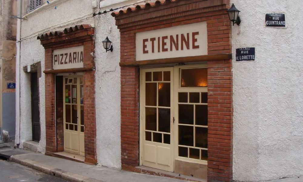 Restaurant front with exposed brick and terracotta tiles
