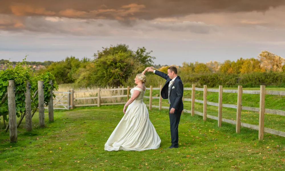 couple dancing in field
