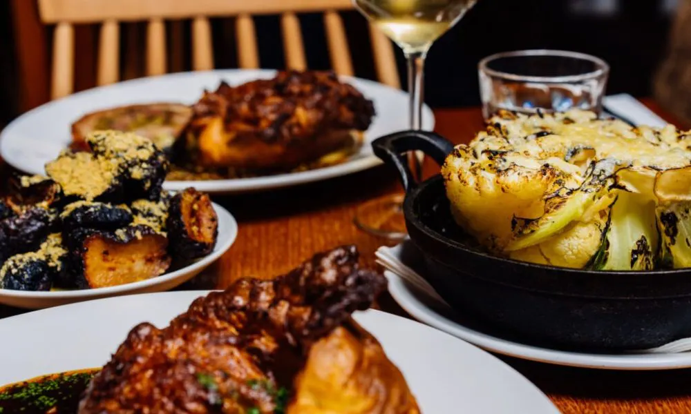 close up of charred hispi cabbage and roast chicken