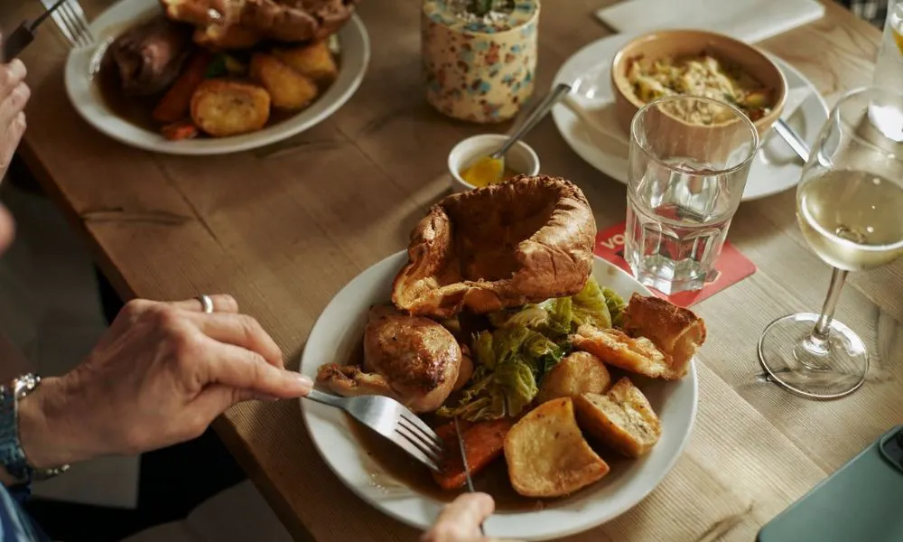 large roast dinner with potatoes and carrots