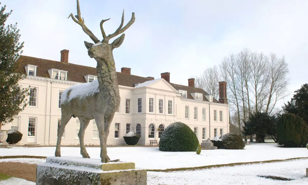 exterior shot of snowy scene at gosfield hall wedding venue