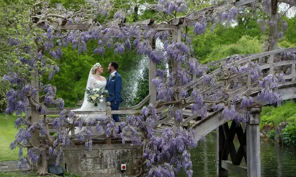 Couple on wisteria bridge