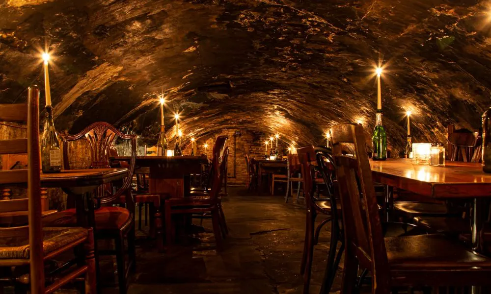 vaulted basement with candlelit tables