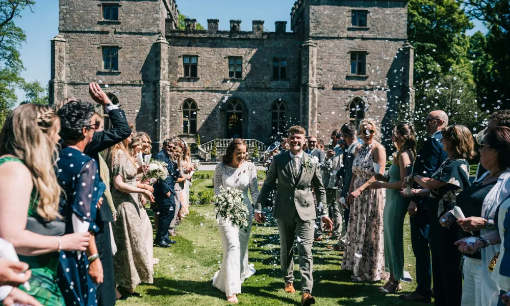 Stone castle exterior with newly weds 