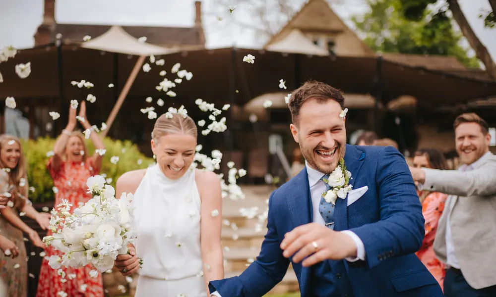 couple post-ceremony with confetti in the air