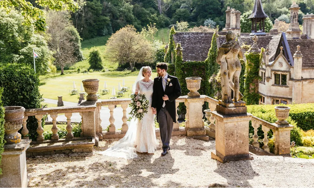 A bride and groom outside The Manor House Exclusive Collection