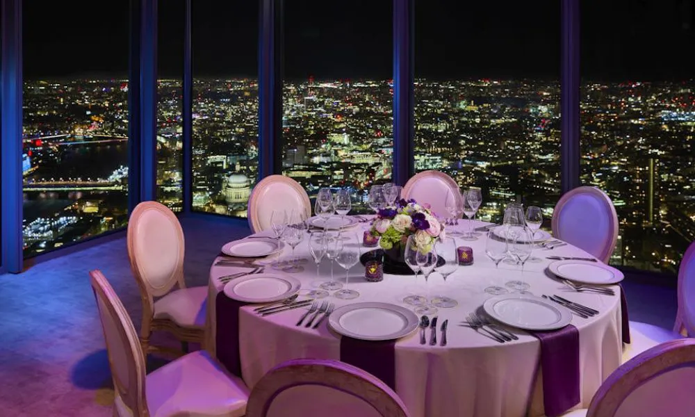 wedding table with city at night visible from window