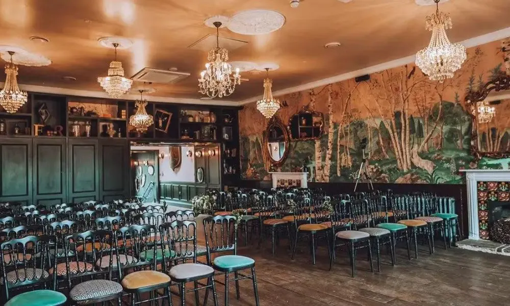 The aisle and murals at the Bell in Ticehurst