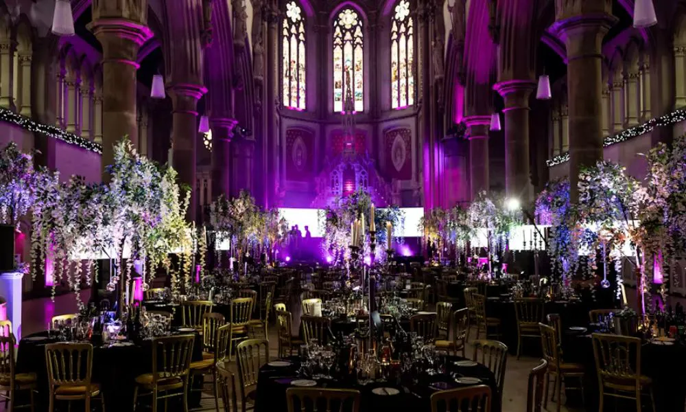 Impressive floral displays at height lit with purple lighting