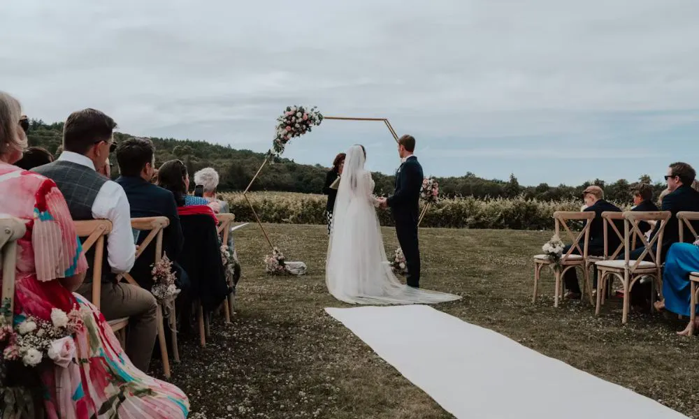 An outdoor aisle and white runner