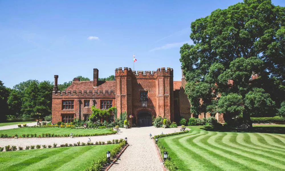 large red brick building with turrets and chimneys