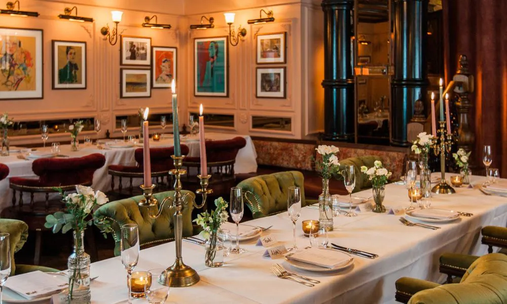 ornate pub back room set with flowers and candles