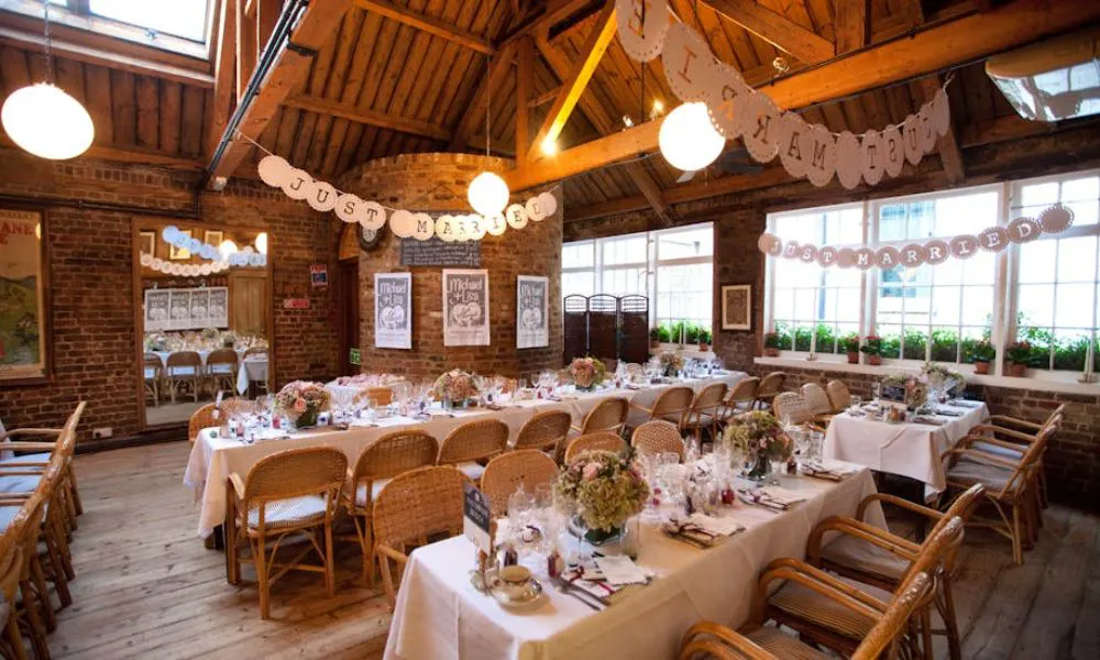 brick walled dining room with wicker chairs
