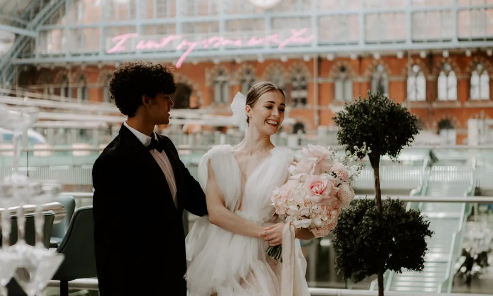 bride and groom in st pancras international station