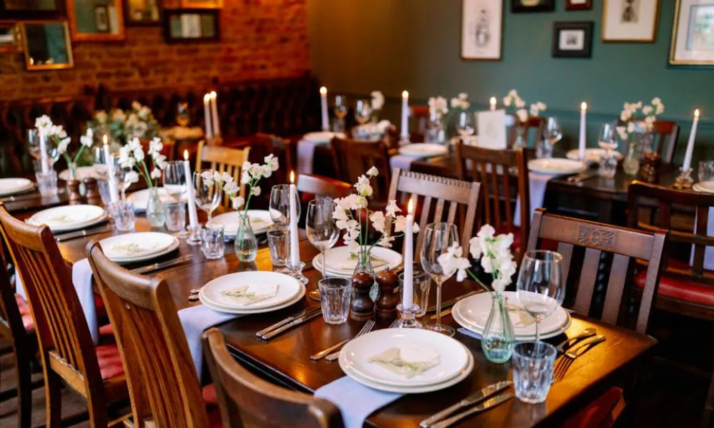 pub wedding venue with flowers and candles