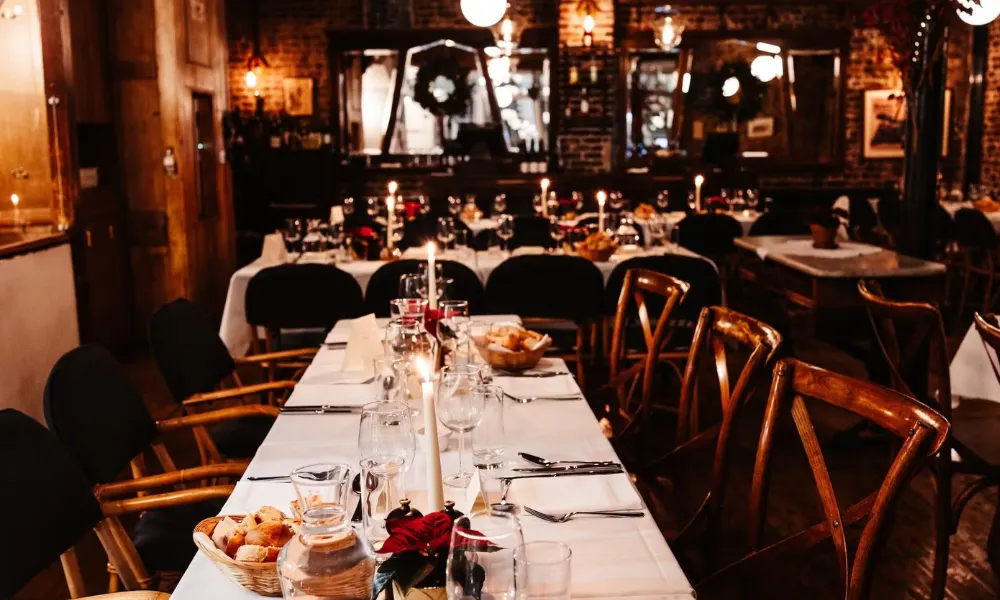 cosy french dining room with candles and flowers