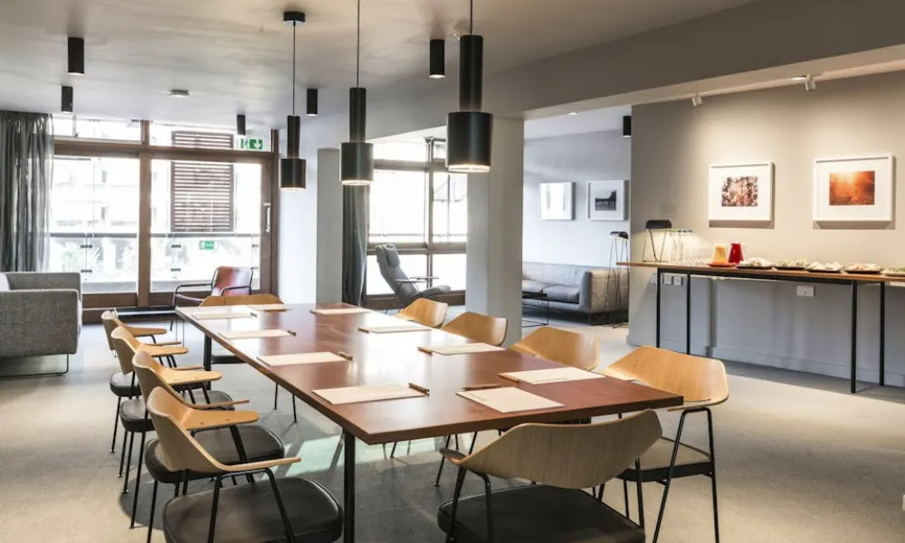 meeting room with sofas, and central table