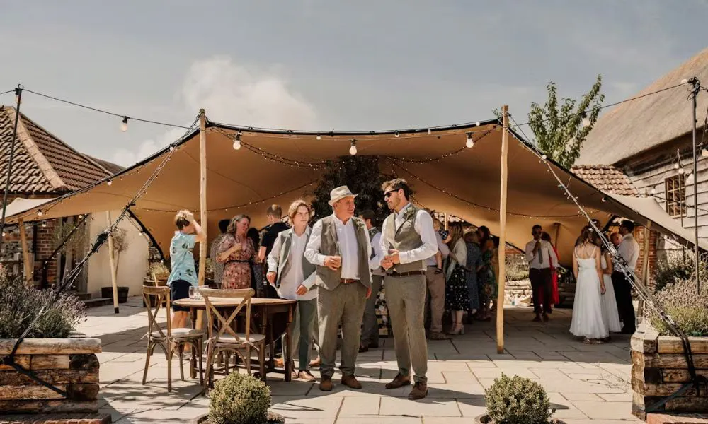 A father of the groom and the groom at an outdoor wedding