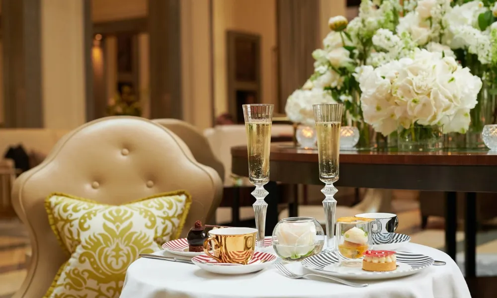 cakes and long champagne flutes on a table