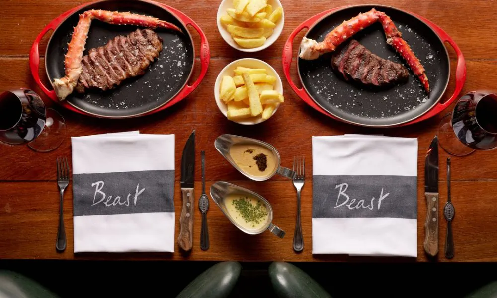 plates of surf and turf at Beast restaurant