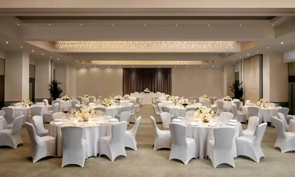 a grand ballroom set up for a wedding breakfast