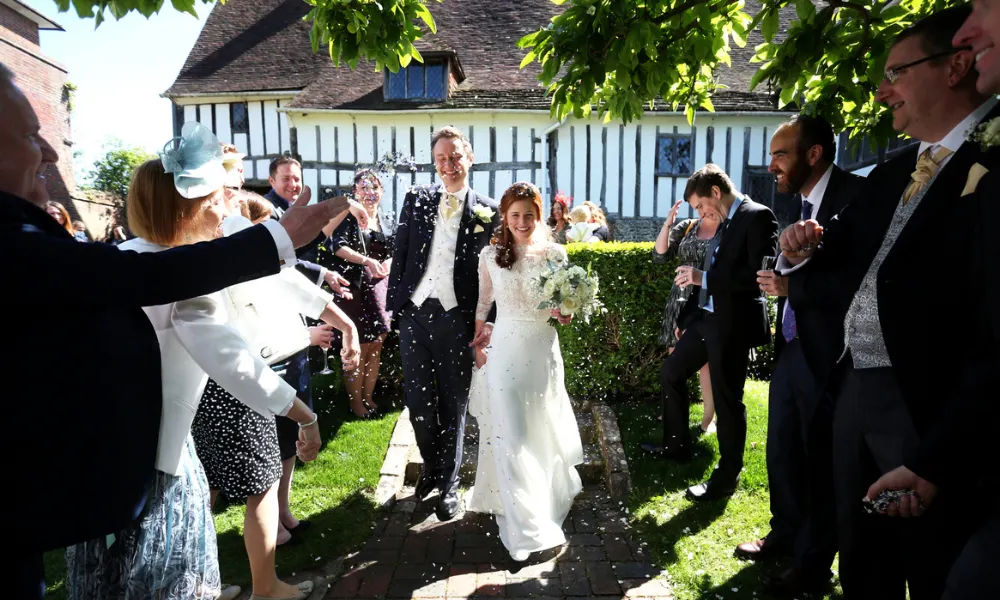 Confetti throwing outside tudor house