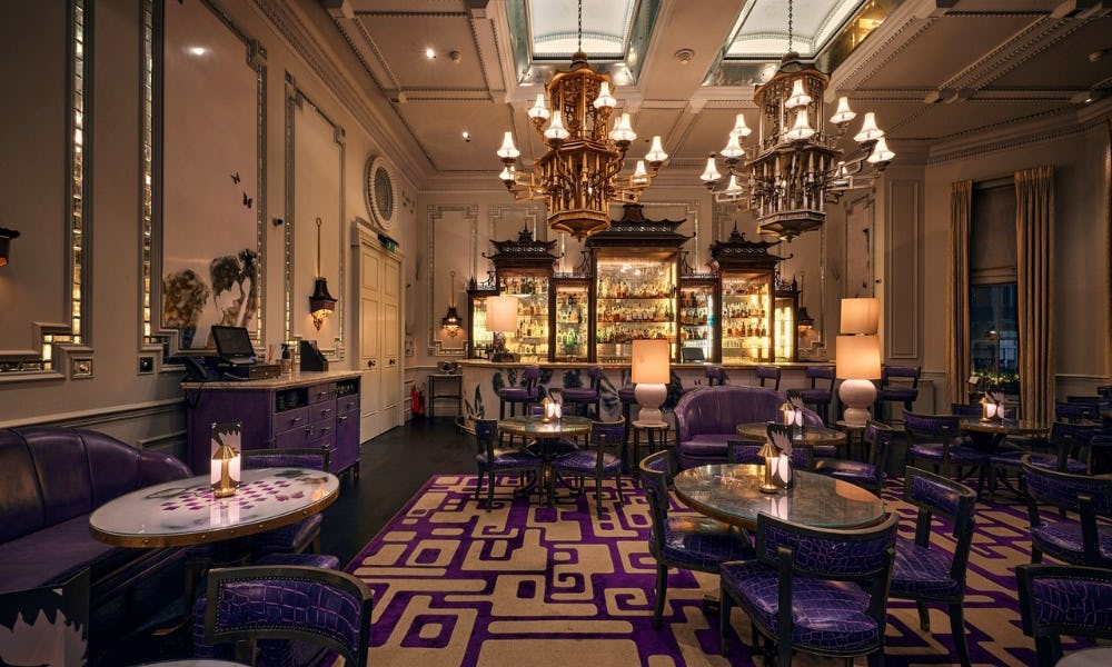 Ornate cocktail lounge with purple patterned accents