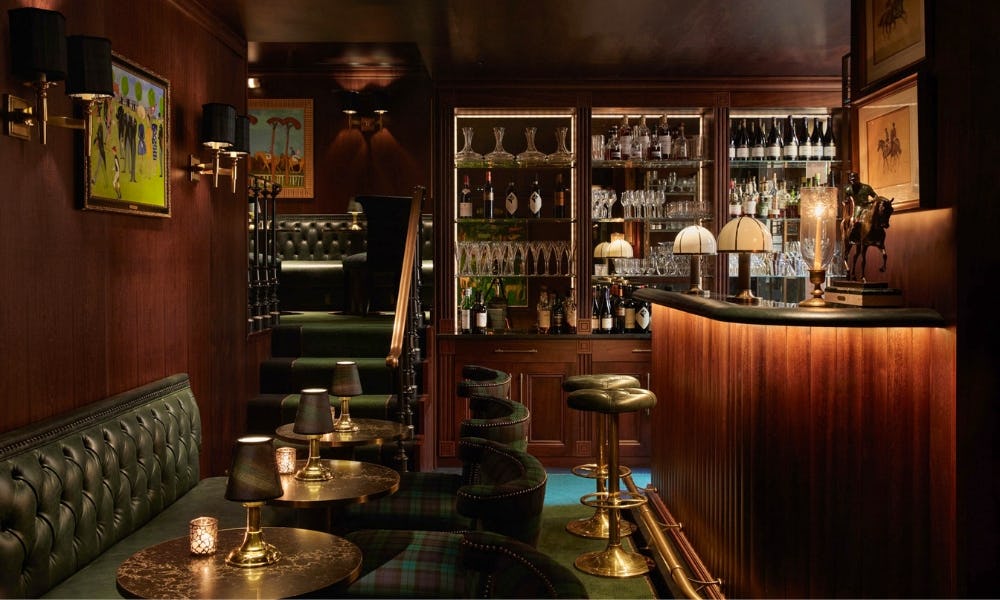 Small hotel bar with wood panelling and tartan