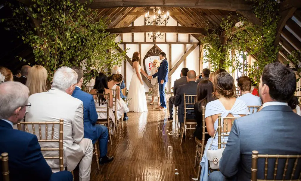 a couple getting married in a barn