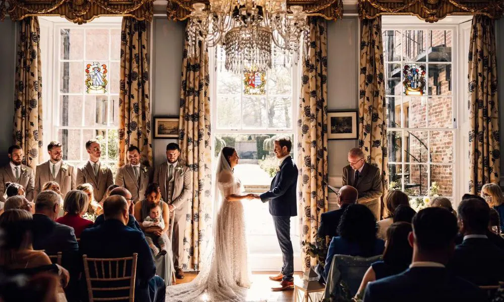 a couple getting married in a historic country house